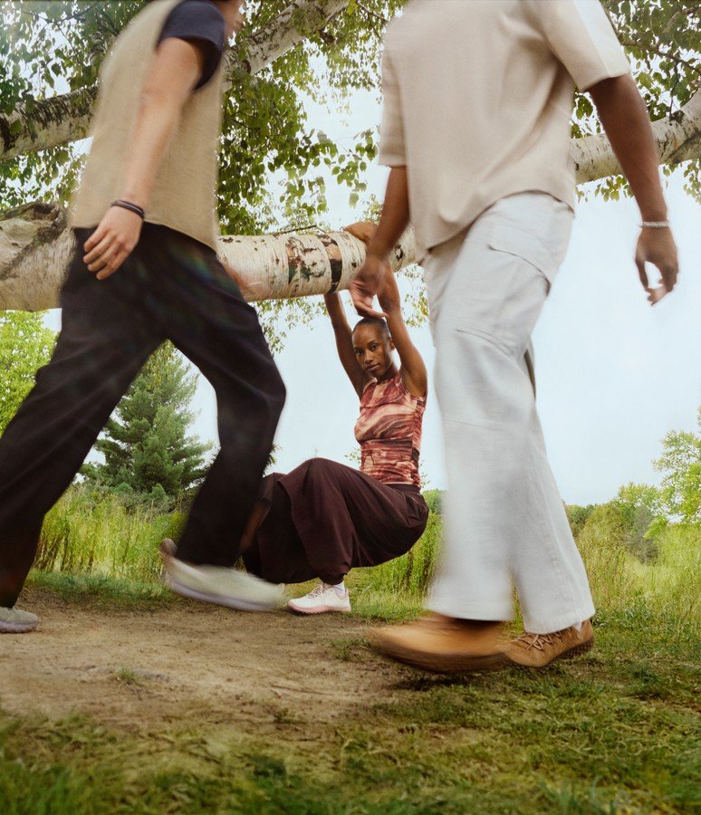 Family walking on a woodland trail in Merrell barefoot shoes